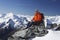 Mountain Climber Using Laptop On Mountain Peak