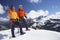 Mountain Climber Using Walkie Talkie By Friend On Snowy Peak