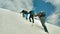 Mountain climbers climbing on northern glacier of Damavand