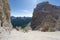 Mountain climbers on a steep scree and rock descent in the Dolomites of Italy in Alta Badia