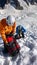 Mountain climbers take a break high up on a glacier in the French Alps