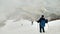 Mountain climbers trekking down in snow