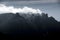 Mountain clouds at sunset, above high peaks