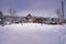 Mountain cottages on a snowy hill in snow season