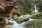 Mountain creek and cute waterfall in it`s amphitheater