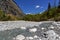 Mountain creek stream-bed in alpine reserve stony ground