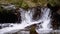 Mountain Creek. Water moves down through Rocks in the Mountains