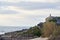 Mountain cyclist observes the sea from the top of the cliff