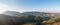 Mountain forest landscape panorama aerial drone view. Olive grove, blue sky