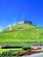 Mountain, fortress, blue sky, green grass, sunny day