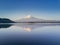 Mountain Fuji reflected in Kawaguchiko lake on a sunny day and clear sky