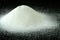 A Mountain of Granulated Sugar on a Black Background