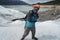 A mountain guide helps ice trekking tourists on Perito Moreno Glacier in the Los Glaciares National Park