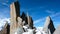 Mountain guide and a male client on a rocky ridge heading towards a high summit in the French Alps near Chamonix