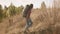 Mountain hiker man and woman climbing a steep hill.