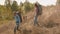 Mountain hiker man and woman walking down the hill