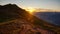 mountain hiking trail in the sunrise. Adventurous bike trail, hiking trail in mountains above Davos Switzerland