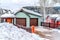 Mountain home facade with attached two car garage against cloudy sky in winter