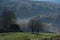 Mountain homestead in the autumn. House with thatched roof