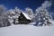 Mountain house in snow