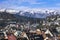 The mountain and the houses in the snow and a town in the Alps in winter