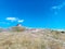 Mountain hut on the heights, the sky is blue and you have to walk a lot uphill