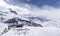 Mountain huts on the tops of towering Alps.