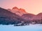Mountain illuminated by sunrise in winter Alps. Freezy morning alpine landscape