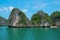 Mountain island and lonely beach in Halong Bay