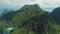 Mountain island at ocean bay aerial panoramic shot. Epic seascape at green tropic forests on isle