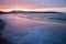 Mountain Jaizkibel backlit on atlantic coastline in beautiful pink sunset, hendaye, france