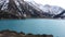 A mountain lake with blue water in winter