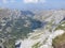 Mountain lake in bottom of the valley landscape rocky valley and ranges