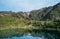 Mountain lake Estany de les Truites in Andorra Pyrenees, La Massana, refugi de coma pedrosa