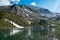 Mountain lake Estany de les Truites in Andorra Pyrenees, La Massana, refugi de coma pedrosa