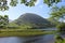 Mountain and lake framed by trees Lake District