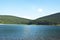 Mountain lake incredible landscape with clear sky, calm water and specular reflection. Best place to relax and feel unity with nat