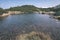 mountain lake panorama view in late summer in Slovakian Carpathian Tatra with reflections of rocky hills in water. Rohacske plesa