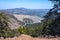 Mountain lake among picturesque ocher slopes of the Troodos