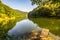 Mountain lake with pontoon and blue sky