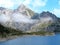 Mountain lake with soft clouds high alpine landscape