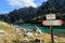 Mountain lake with trekking signboard