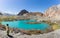 Mountain lake under the sunny day with blue sky along Karakorum Highway in Passu,