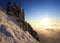 Mountain landscape above a sea of clouds at sunset