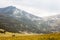 Mountain landscape with couple of silhouette hikers