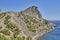 Mountain landscape, Crimean peninsula. People walk along the tourist route Golitsyn Trail. Botanical reserve New World.