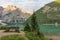 Mountain landscape of Lake Braies with a bench, a church and in the background the Croda del Becco