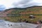 Mountain landscape with a lake and reflected mountains and forest in autumn. Sanabria Lake, Zamora, Spain