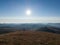 The mountain landscape of the mountain Zlatibor in Serbia seen from the mountain peak Crni vrh in the morning