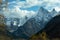 Mountain landscape. Peaks of mountains with fluffy clouds in the distance. North Caucasus